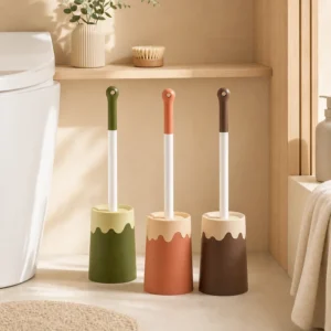 Brown ice cream style toilet brush with matching holder on white background