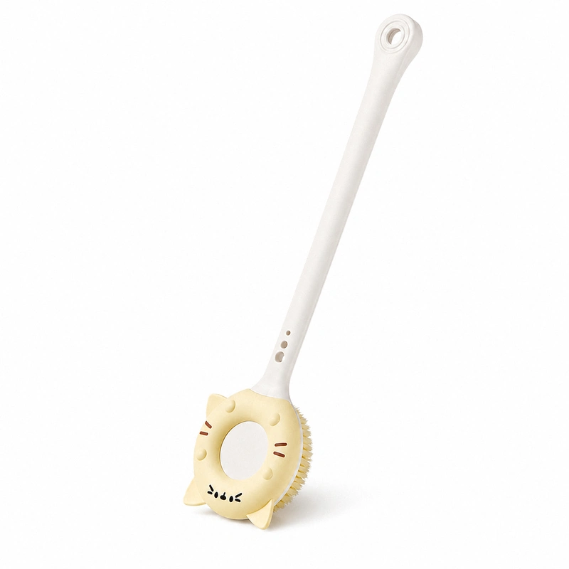 Yellow cat bath brush white background