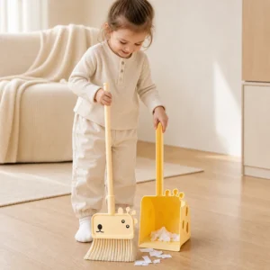 Child using kids giraffe broom for Montessori cleaning play at home