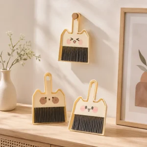 Side view of compact desktop cleaning brush and nesting dustpan