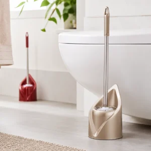 Champagne gold leaf holder toilet brush in bathroom