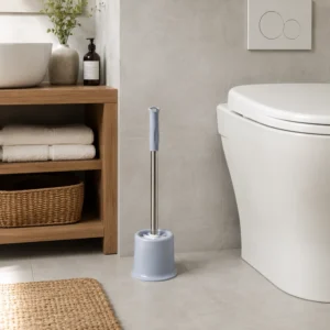 Light gray toilet brush for bathroom storage beside toilet