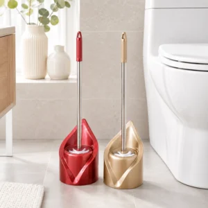 Red and champagne gold leaf holder toilet brush set beside toilet